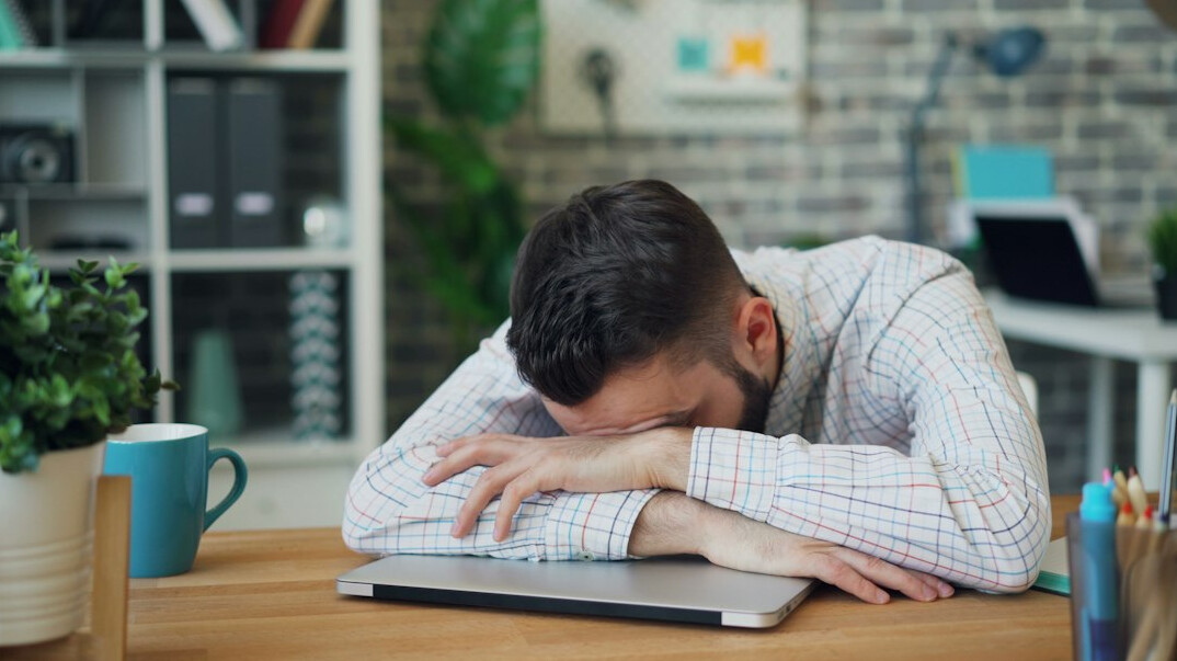 tired office worker at desk