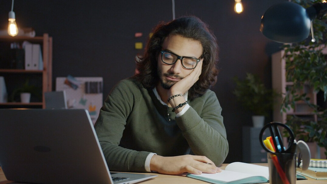 tired office worker at desk